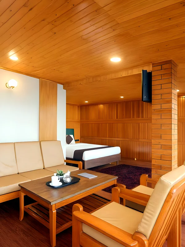Superior Double Room with Extra Bed at Hotel Apsara Darjeeling with a mountain view — wood-panelled bedroom