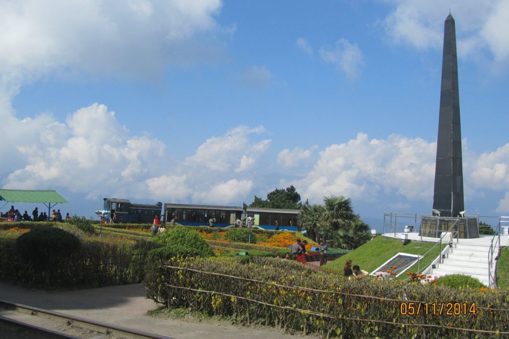 Gorkha War Memorial at Batasia Loop with the toy train passing